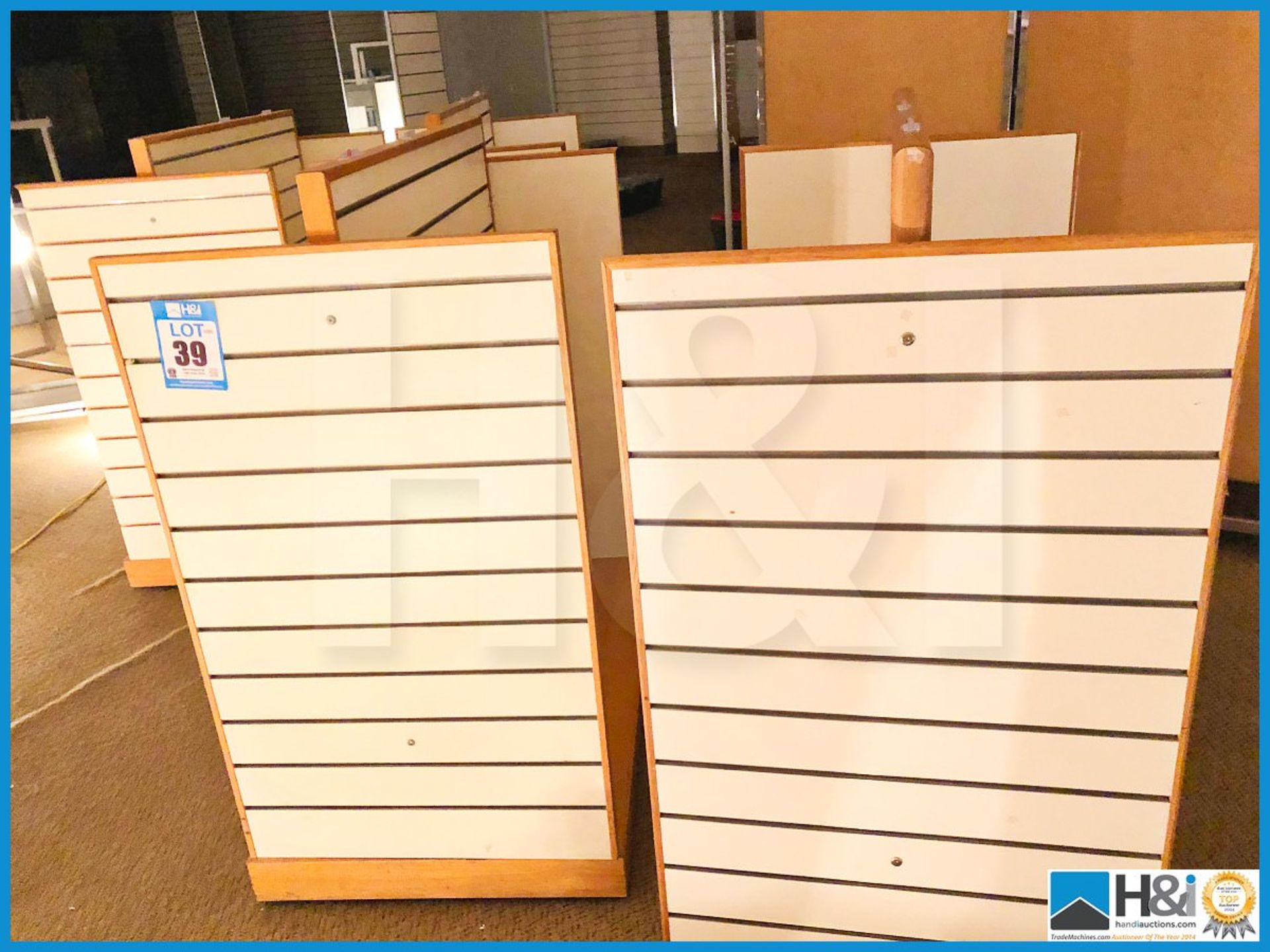 Four freestanding slat wall modular display units 1300mm X 750mm X 1400mm.