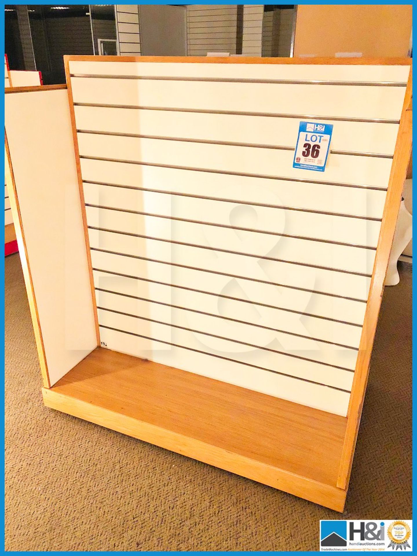 Three freestanding slat wall modular display units 1300mm X 750mm X 1400mm.