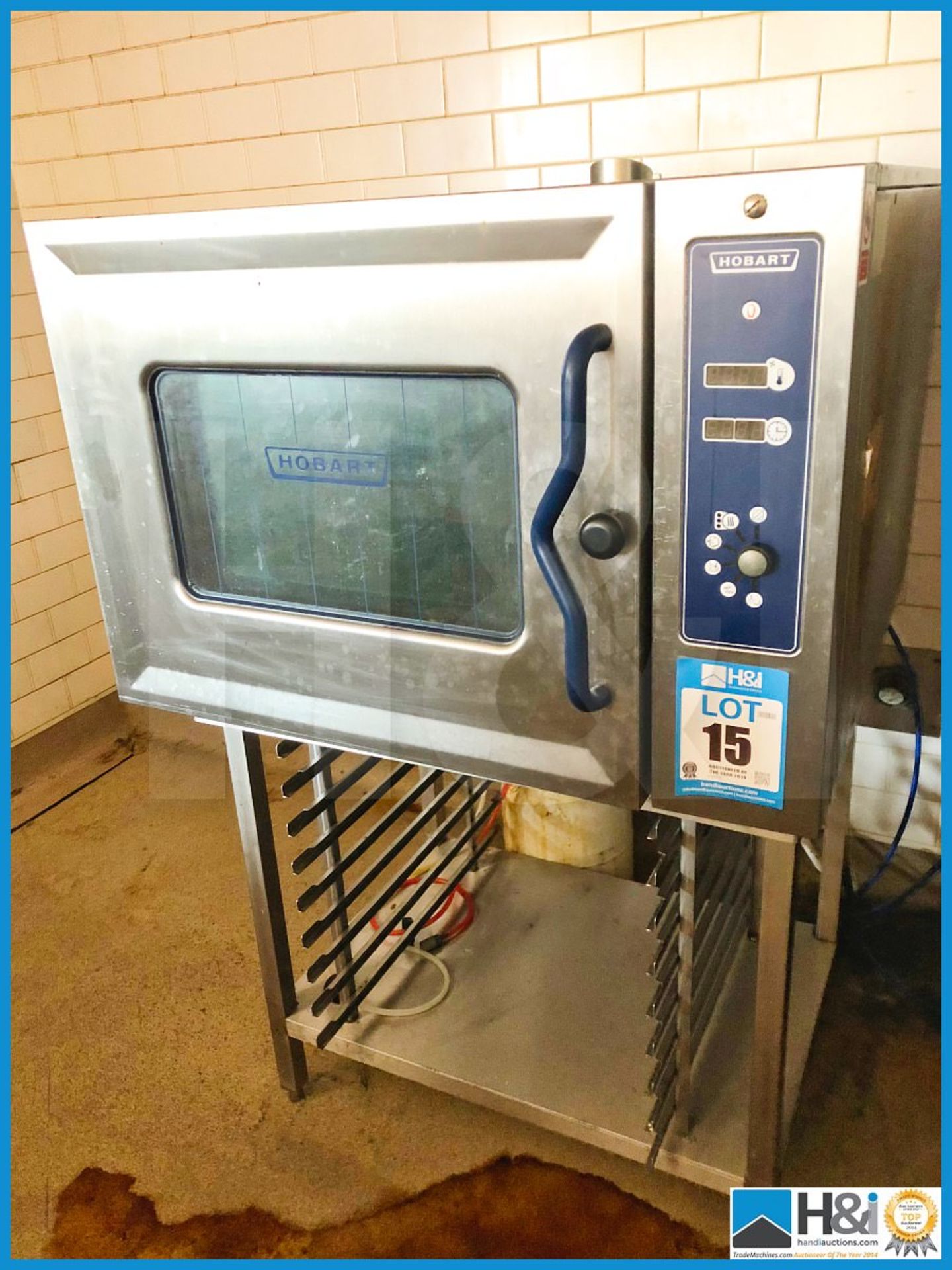 Hobart commercial oven stainless steel 3 phase on stainless steel rack stand.