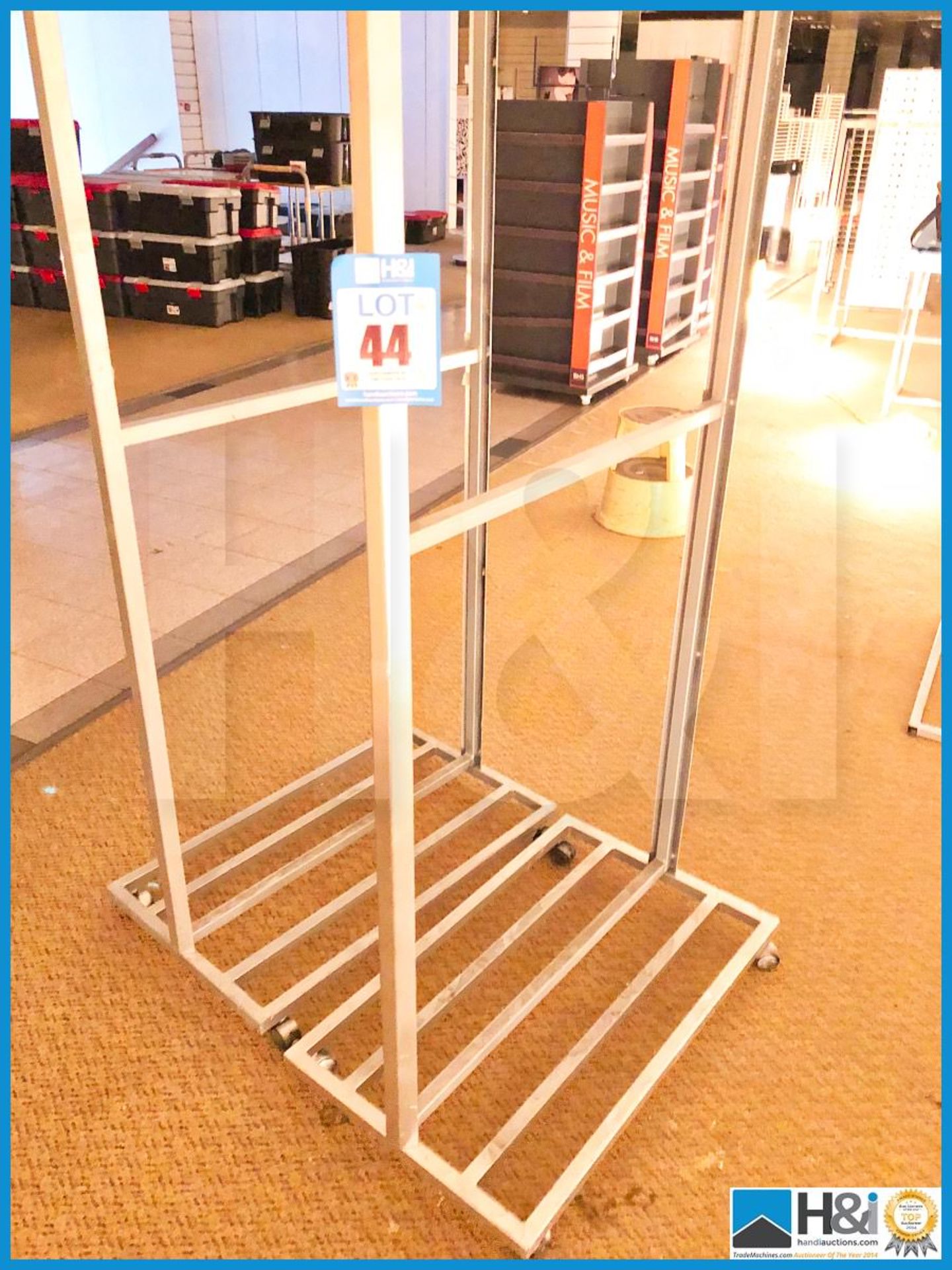 Seven metal shop poster display stands freestanding.