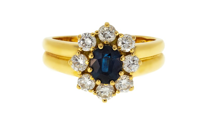 Bucherer bague or 750 sertie d'un saphir taille ovale entouré de diamants taille brillant doigt 53.