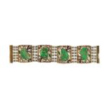 CMP Large bracelet métal doré et émail à décor végétal serti de plaques de jadéites gravées de rubis
