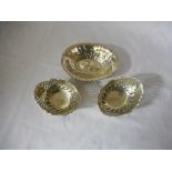 A pair of Continental silver oval bon bon dishes with saw pierced and repousse decoration, raised on