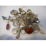 Fifteen silver pendants and chains, some set hardstones, a silver bead ring and six other rings