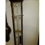 A reproduction Admiral Fitzroy barometer in a mahogany case