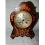 An Edwardian mantel clock with silvered dial, the dial marked Laine of Paris striking movement on