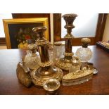 Eight glass toilet jars with silver lids, a silver mounted nail buffer with hobnail glass holder (