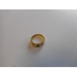 An 18ct. gold ring set three diamonds