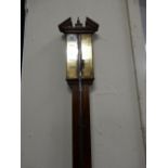 A Georgian design stick barometer on an oak mount - 36in. high