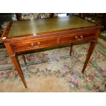 An Edwardian mahogany and satinwood crossbanded and inlaid writing table with green and gilt