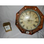 A postman's alarm clock with cream enamel dial, octagonal case with painted, incised and mother of