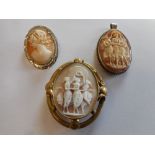 A carved shell cameo brooch depicting the Three Graces in a pinchbeck frame, a carved shell cameo