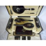 A lady's eleven piece silver and tortoiseshell dressing table set comprising:- tray, pair of hair