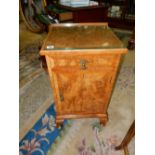 A reproduction walnut bedside cabinet fitted drawer, cupboard under, on cabriole legs - 16in. wide