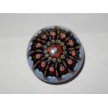 A French style paperweight, blue with pink, red yellow and blue floral and twist canes - 3in. dia.