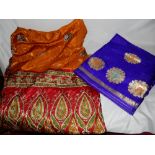 Two silk saris, table cloths etc..