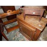 A mahogany cupboard fitted panelled door, on platform base - 25 1/2in. wide, a set of mahogany three