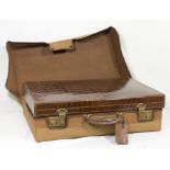 A brown crocodile skin suitcase by Cleghorn of Edinburgh, the interior fitted hand mirror, two