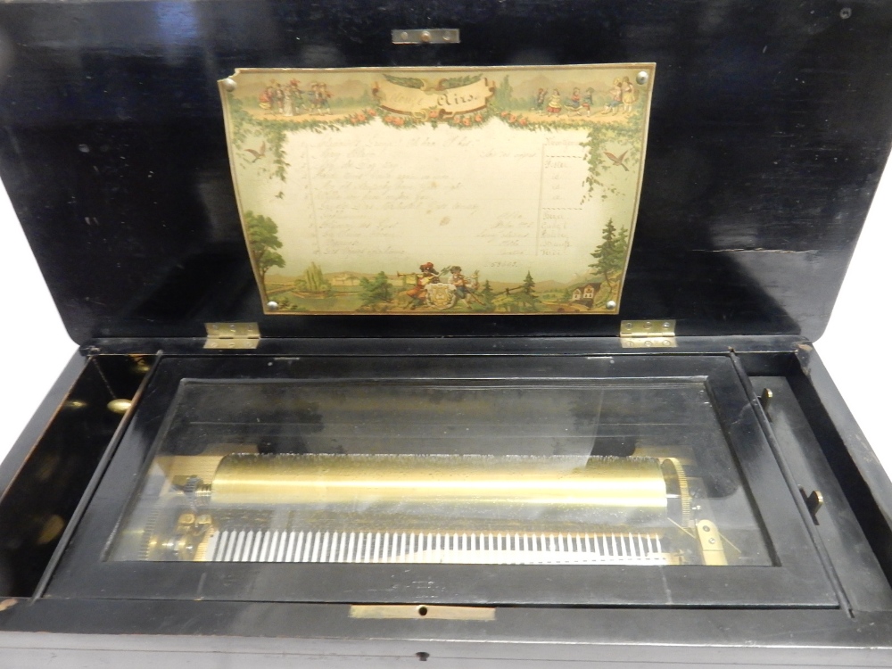 A 19th Century musical box playing twelve airs in a rosewood, ebonised and marquetry inlaid case