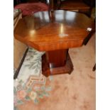 An Art Deco occasional table with octagonal top, on panelled column and square base