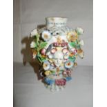 An 18th Century English vase with pierced decoration to the neck, painted moths and insects and