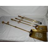 Three brass long handled fire implements