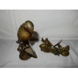 A Chinese bronze desk weight in the form of two figures, a fish and fishing net - 3in. high and an