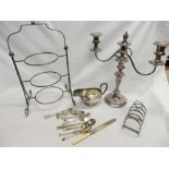 A selection of silver plate including a three branch candelabra, oval tray, sauce boat, cake stand