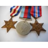 A group of three Second World War medals including a France and Germany star, 1939-45 Star and War