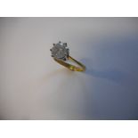 A lady's solitaire diamond ring on an 18ct. gold shank