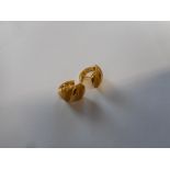 A pair of 18ct. gold earrings