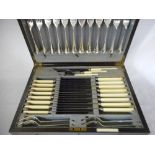 A 1930's oak canteen of silver plated flatware by John Round and Son