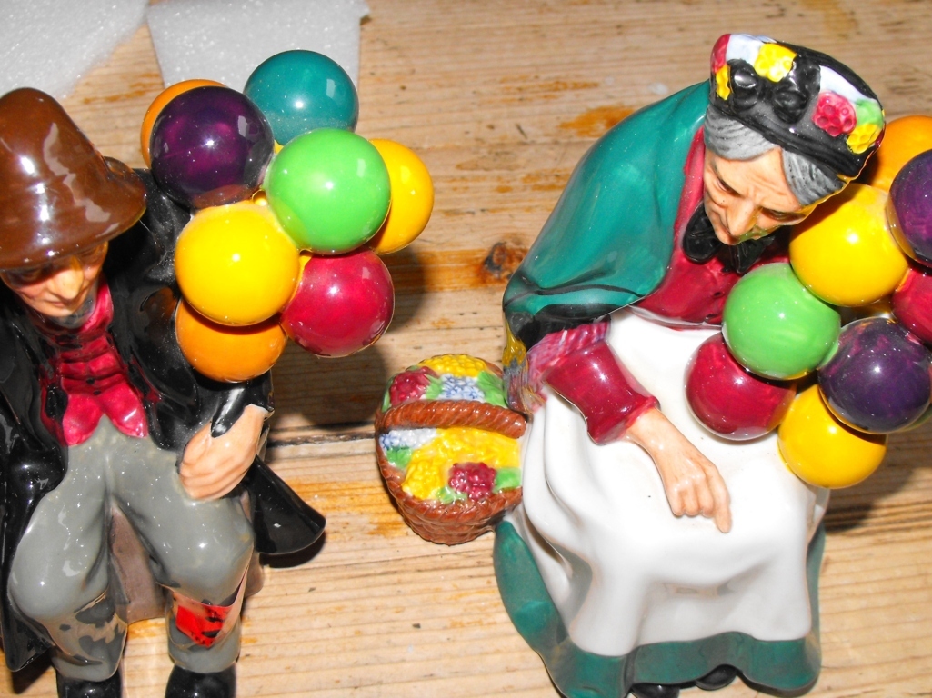 Pair of Royal Doulton Figures of The Balloon Man and the Old Balloon Seller.