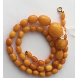 Antique/Vintage String of Butterscotch Amber/Bakelite Beads - 33 grams and 55cm long.