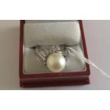 14 karat (585) Gold and Pearl Ring size UK (S) - US (9 1/4) total weight 12.2 grams.