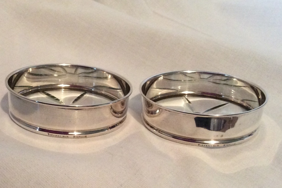Pair vintage Tiffany &Co sterling silver & cut glass bottle coasters diameter of each one 7.5cm.