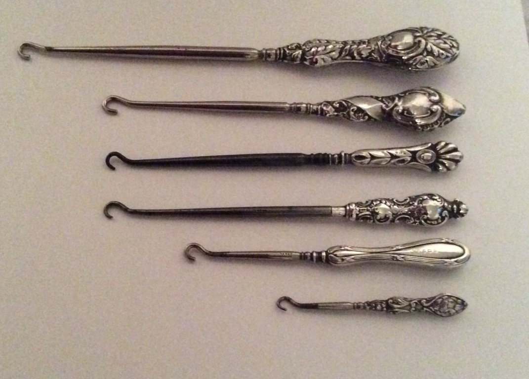 Lot of 6 Antique/ Vintage silver handled button hooks good condition.