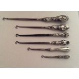 Lot of 6 Antique/ Vintage silver handled button hooks good condition.