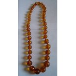 Vintage Honey Coloured Amber Necklace - 34 grams - 19 1/2" long.