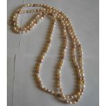 Silver and Cultured Baroque Pearl Necklace -54 inches long with white, peach and plum Pearls - 77g.