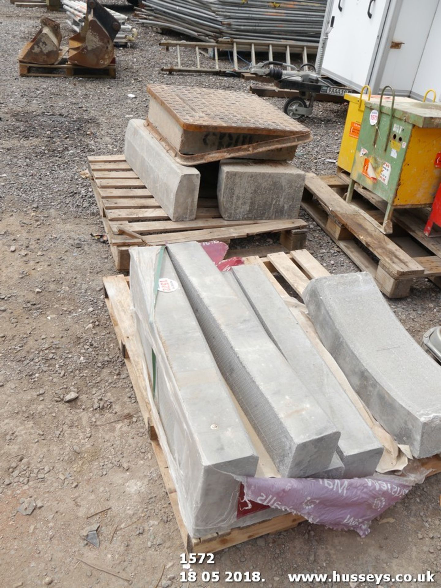 KERB STONES ON 2 PALLETS & MANHOLE COVER