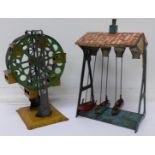 A pre-war German tin plate ferris wheel and a German fairground ride,