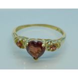 A 9ct gold and garnet ring, 1.