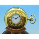 A Rotary plated demi-hunter pocket watch with manual wind movement and wooden pocket watch stand