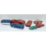 A collection of plastic vehicles including a car and touring caravan