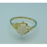 A 9ct gold, opal and diamond ring, 0.