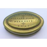 A miner's brass snuff tin marked John Wade Gockett Farm, Monmouth 1908,