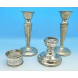 A pair of silver candlesticks,