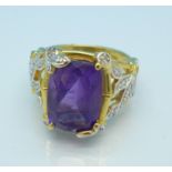 A silver gilt, amethyst and four diamond ring,