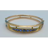 An Edwardian 9ct gold, sapphire and diamond bangle, Chester 1909, 10.